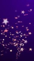 A stream of golden stars flowing towards the camera on a purple gradient background. Full HD and looping vertical animation. video