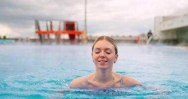 Pretty Woman Swimming In Warm Water Of Outdoor Pool, Feel Good And Have Fun In Weekend video