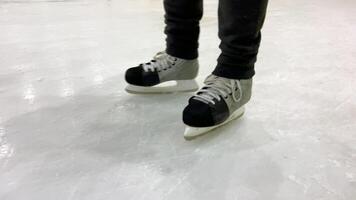 Ice hockey player practicing skating on ice rink video