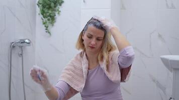 Transforming hair with a new color in a cozy bathroom setting video