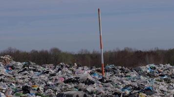 Numerous layers of garbage accumulate at the landfill, showcasing the critical issue of waste management and its effects on pollution and ecology video