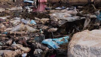 A large accumulation of plastic debris and garbage fills a landfill site, highlighting the ongoing challenge of waste management and pollution video
