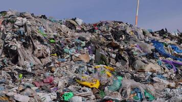 Footage shows a massive landfill filled with plastic debris and garbage, highlighting pollution and waste management challenges video