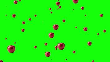 Red apples falling and raining down against a green screen background, perfect for chroma key compositing, abstract fruit animation element. video