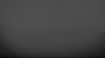 Repeating vintage film dust texture with analog grain patterns and cinematic scratches perfect for retro photo overlays. design backgrounds or classic film-inspired visual projects video