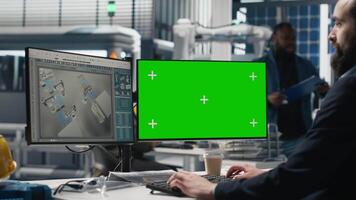 Male technician in a solar panel plant uses chroma key for system performance, playing a crucial role in monitoring efficiency and workplace safety. Renewable power concept. Camera A. video