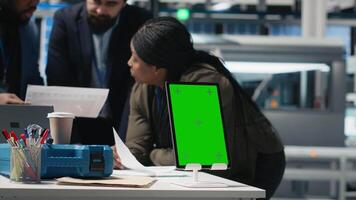 Team of consultants and experts working with a chroma key screen in the solar panel facility, ensuring manufacturing process efficiency with clean energy and solar technology. Camera A. video