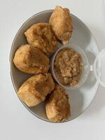Homemade Batagor mini with Nut Sauce, Side View photo