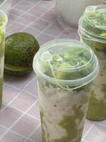 A table with four plastic containers with food in them photo
