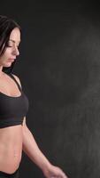 Dynamic fitness woman claps her hands, creating a cloud of dust video