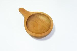Isolated wooden bowl with handle on white background showcasing craftsmanship photo
