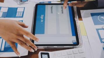 A person is using a tablet to check the status of a project video