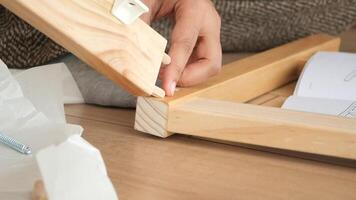 Assembling wooden furniture using simple tools at home video