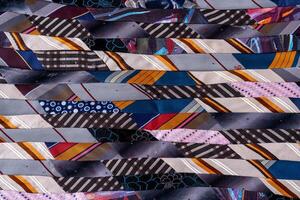Patchwork Blanket. A fragment of colorful pieces of fabric sewn together. photo