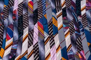 Patchwork. A fragment of multi-colored pieces of fabric sewn together. photo