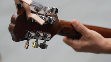 Guitar tuning session in an outdoor setting video