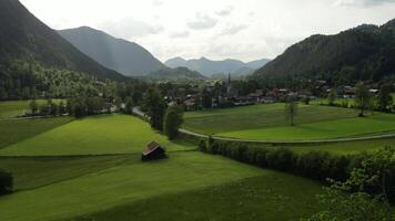 A view of a village in the mountains with green grass video