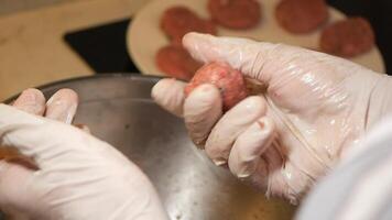 Preparing meatballs in a kitchen with careful techniques video