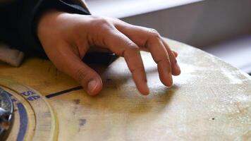Hand engages with textured surface in creativity video