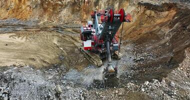 Large excavator digging in open pit mine. Stock clip video