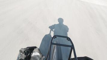 Cyclist shadow on asphalt during bicycle touring, symbolizing freedom, adventure, self-discovery, resilience, minimalism, journey through remote landscapes. Vertical copy space bicycle touring banner video