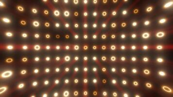 Glowing golden-yellow rings form a symmetrical tunnel of light and shadow, evoking speed and futuristic energy video