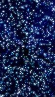 Dark abstract background with glowing blue star-like lights scattered in a cosmic space pattern video