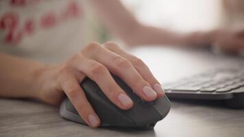 Hand Using a Computer Mouse with Keyboard in Background video