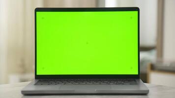 Laptop with Green Screen for Mockup or Chroma Key Editing video
