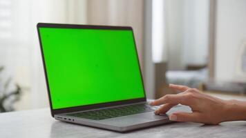 Close-up of Hand Using Laptop with Green Screen video