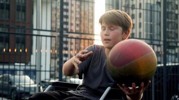 A teenage boy enthusiastically attempts to throw a basketball into the hoop, but unfortunately misses, causing him to become upset. video