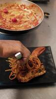 Chef Using Tongs To Grab Spaghetti From The Pan And Preparing The Final Dish video