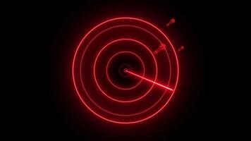 A red neon dart is in the center of a target video