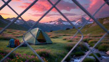 Camping Tent in Valley with Colorful Wildflowers and Mountain View photo