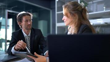 In the office, two businessmen and women discuss and exchange idea and give advice to each other to complete the work,82 photo