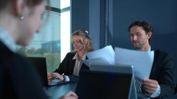 In the conference room, a group of businesspeople are discussing the follow-up meeting and the results of operations,62 photo