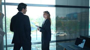 In the office, two businessmen and women discuss and exchange idea and give advice to each other to complete the work,22 photo