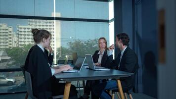 In the conference room, a group of businesspeople are discussing the follow-up meeting and the results of operations,16 photo