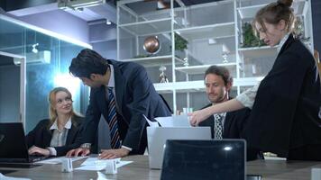 In the conference room, a group of businesspeople are discussing the follow-up meeting and the results of operations,17 photo