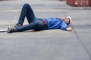 A worker in a container warehouse fainted while working in the bright sunlight and hot weather of a container storage yard,136 photo
