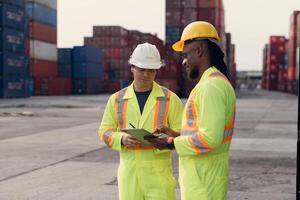 Engineers and technicians supervise and inspect the delivery of containers at container manufacturing and storage site,103 photo