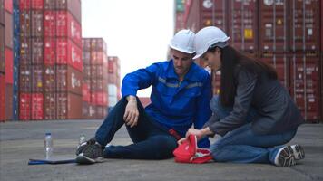 First aid for a container warehouse worker fainted while working in the bright sunlight,49 photo