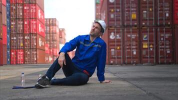 A worker in a container warehouse fainted while working in the bright sunlight,35 photo