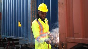 Technicians inspect container repairs by welding at container,2 photo