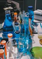A table with many different colored liquids photo