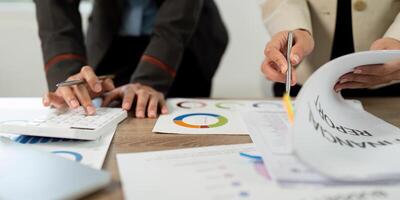 Data Analysis and Financial Reporting. Team members reviewing financial documents. photo