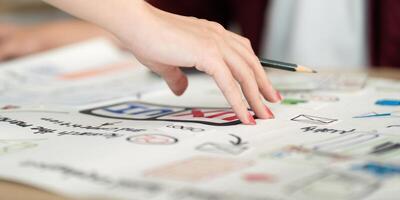Hand Sketching User Interface Elements on Paper photo