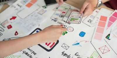 User Experience Design Collaboration. Team brainstorming with UX UI design concepts. photo