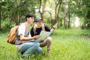 Father and Son Hiking Together. Enjoying a moment of exploration in the forest. photo