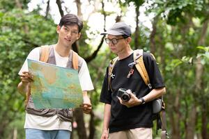 Hiking Adventure. Father and Son Exploring Nature with Map photo